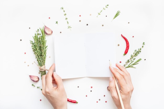 Hands holding recipe book